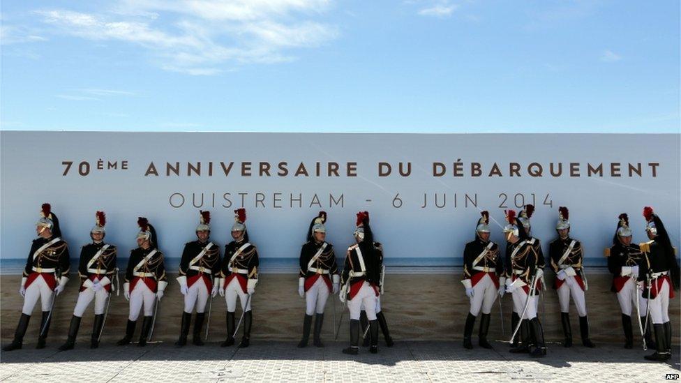 French soldiers in the shade of a wall on a sunny day