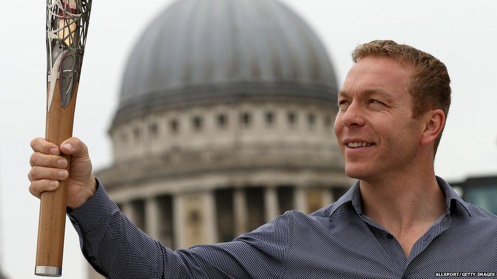 Ambassador and Olympic gold medallist Sir Chris Hoy holds the Queens Baton in front of St Pauls Cathedral