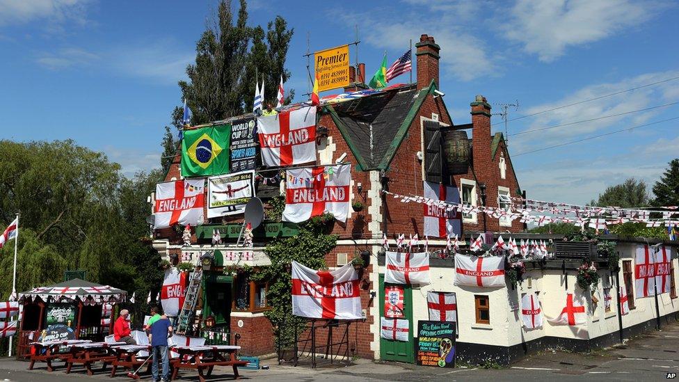 Decorations and flags outside The Robin Hood public house, in Jarrow, England