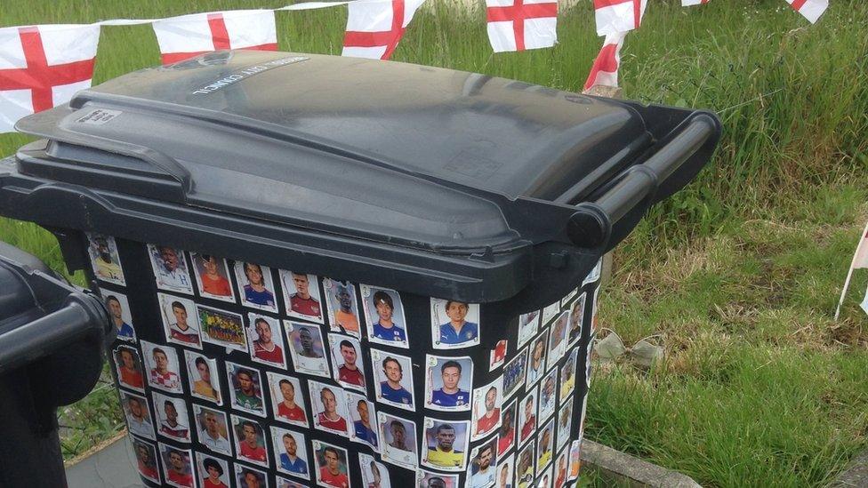 Bin covered in football player stickers outside house in Horfield, Bristol