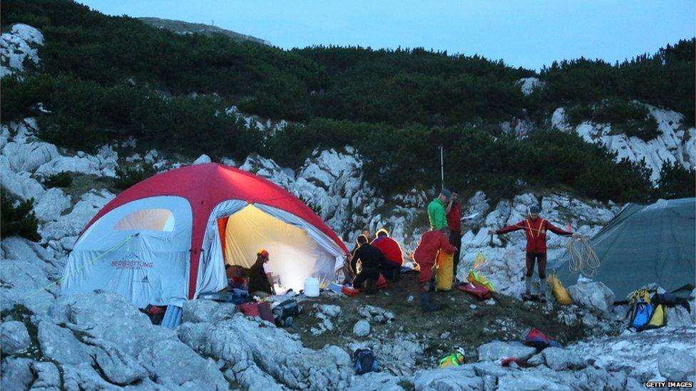 Rescuers at a tent camp near the cave's entrance