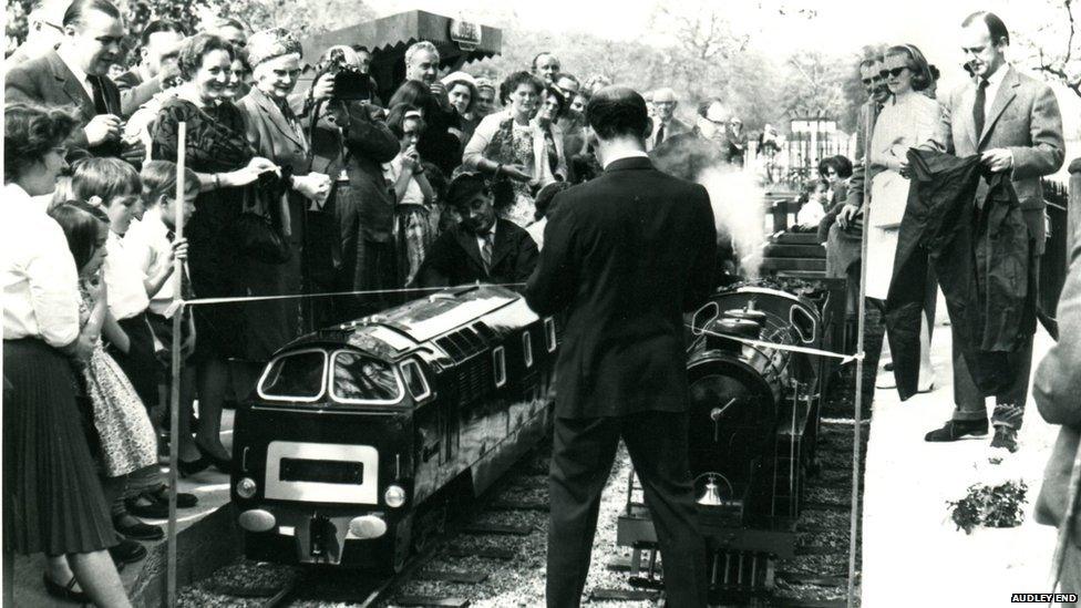 Crowds photographing train