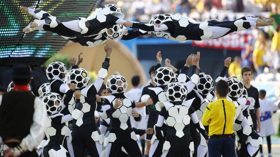 Performers pay tribute to Brazil's football history during the World Cup opening ceremony