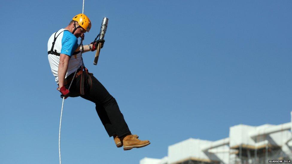 Sir Matthew Pinsent abseiling down the ArcelorMittal Orbit with the Queen's Baton at the Queen Elizabeth Olympic Park, London.