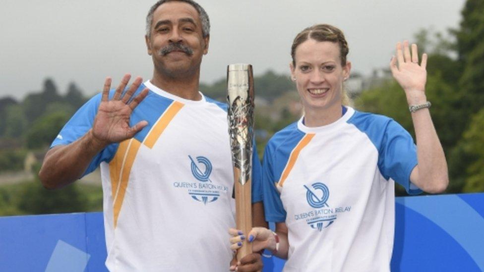 Triple gold medallist Daley Thompson hands over to Scottish athlete Eilidh Child