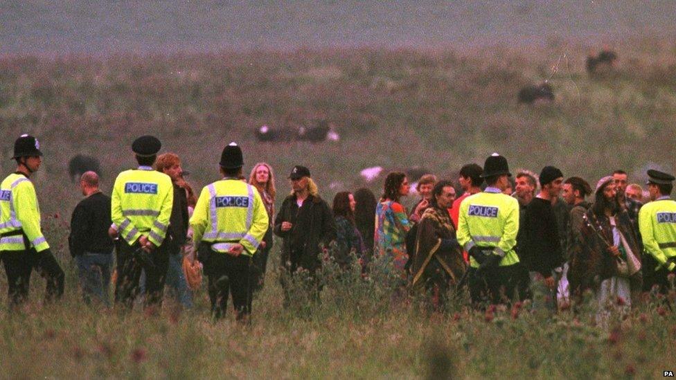 Police confront uninvited visitors within a few hundred yards of Stonehenge in 1998