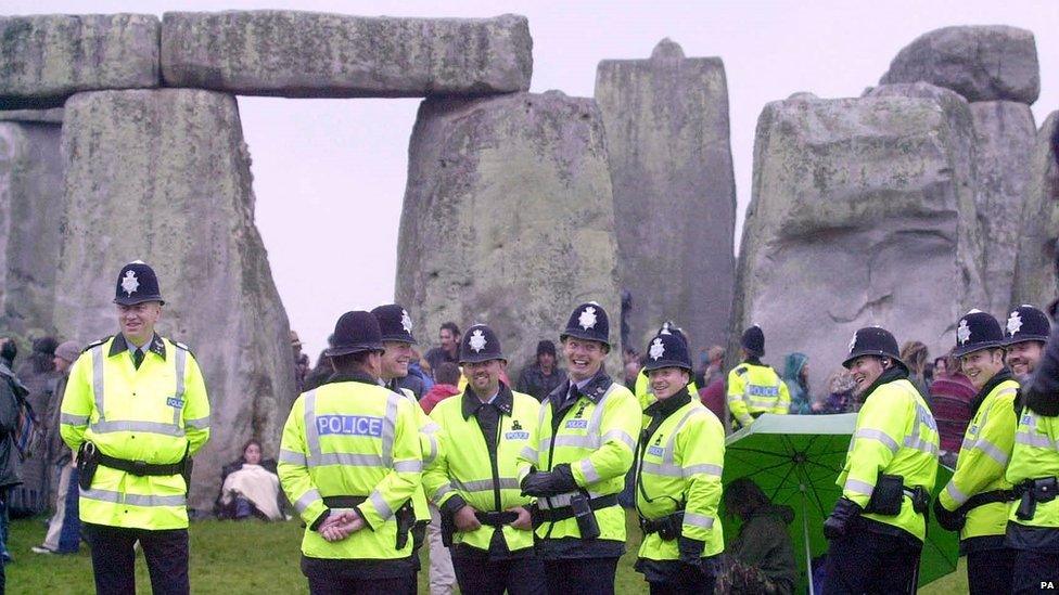 Police on duty for the summer solstice at Stonehenge in 2000.