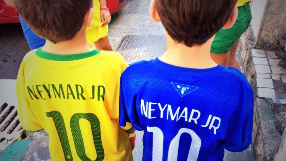 Two kids wearing Neymar shirts