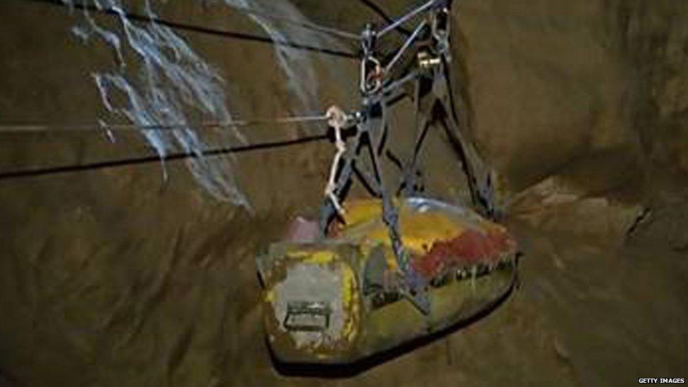 Stretcher carrying injured caver brought to surface. 16 June 2014