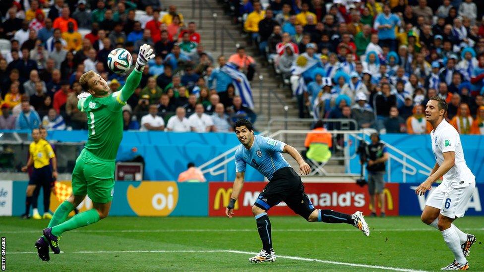 Luis Suarez beats England goalkeeper Joe Hart with a header to put heads Uruguay ahead