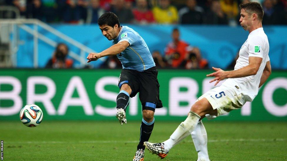 Luis Suarez scores Uruguay's second goal against England at the 2014 World Cup