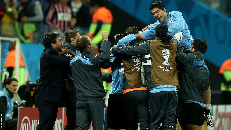 Goal hero Suarez celebrates the 2-1 win with staff and team-mates