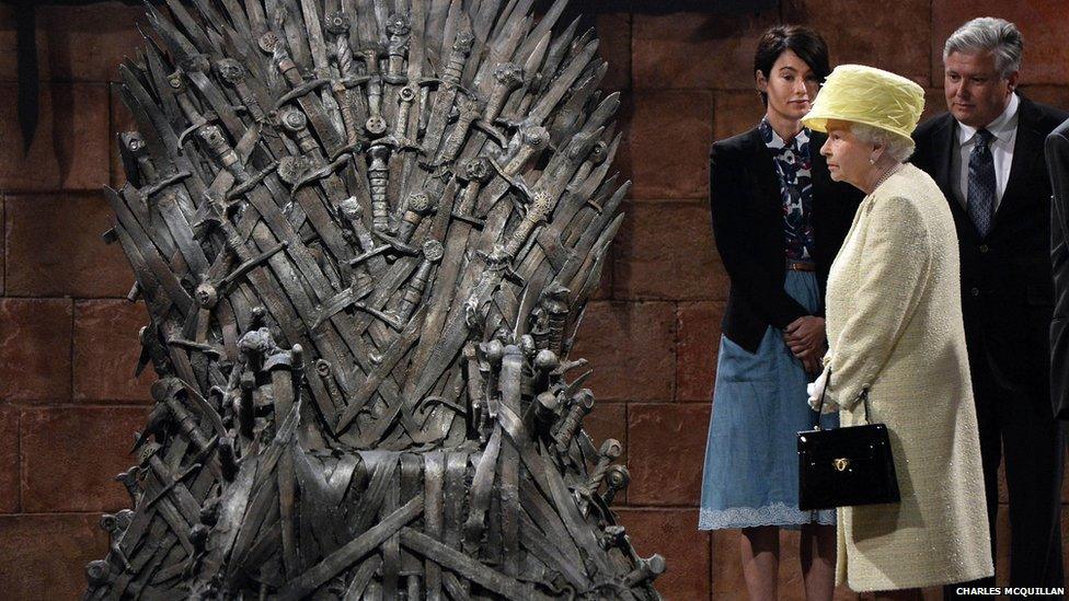 The Queen beside the iconic Iron Throne