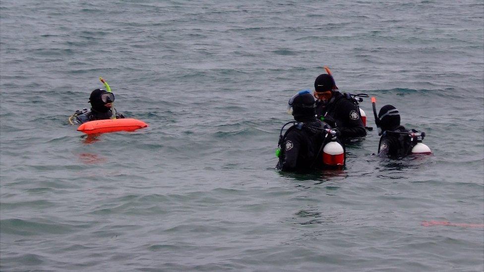 Divers in Guernsey's St Peter Port Harbour