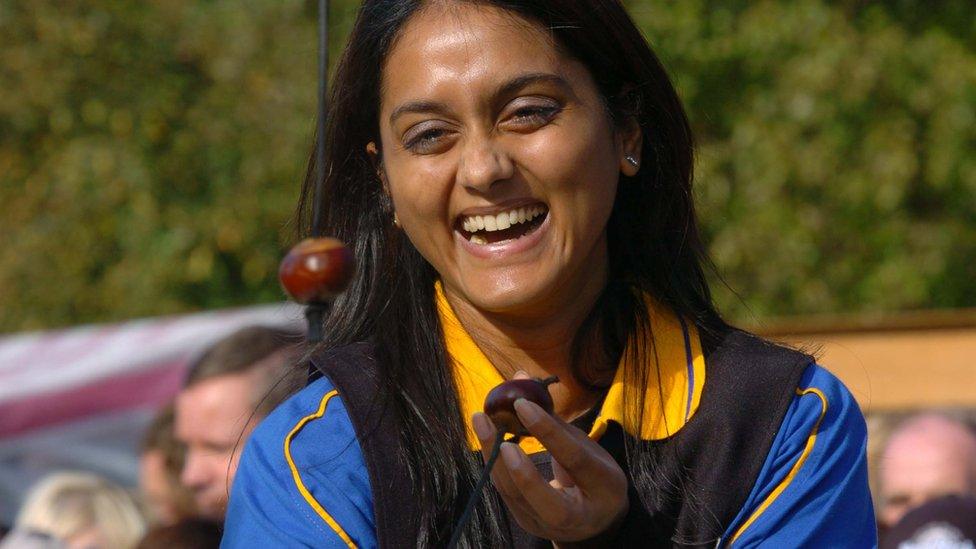 Girl playing conkers