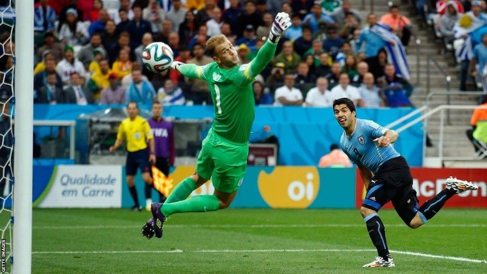 Luis Suarez of Uruguay scores his team's first goal past Joe Hart of England during the World Cup Group D match between Uruguay and England at Arena de Sao Paulo on 19 June