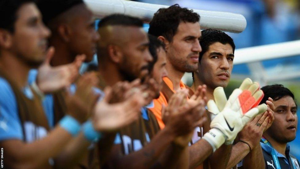 Luis Suarez of Uruguay (right) applauds from the bench during the 2014 Fifa World Cup Group D match between Uruguay and Costa Rica at Castelao on 14 June 14 in Fortaleza