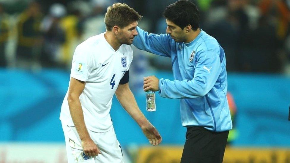 Luis Suarez of Uruguay consoles Steven Gerrard of England after Uruguay's 2-1 victory in the 2014 Fifa World Cupl Group D match between Uruguay and England at Arena de Sao Paulo