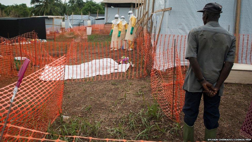 Ebola team near body prepared to show family