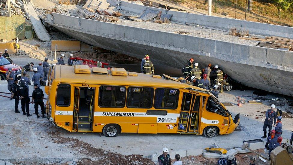 A bus sits damaged after a bridge collapsed in Belo Horizonte, Brazil, on 3 July 2014.