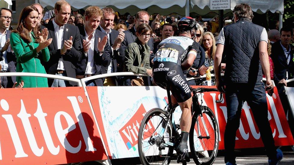 The Duke and Duchess of Cambridge and Prince Harry applaud as Cavendish rides over the finish line