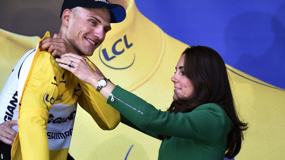 Stage winner Marcel Kittel is presented with his yellow jersey by the Duchess of Cambridge