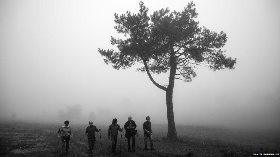 Villagers head of into the hills of Galicia