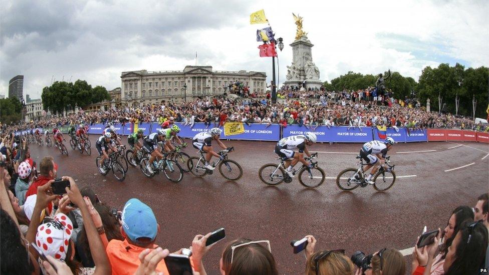 Riders passing Buckingham Palace