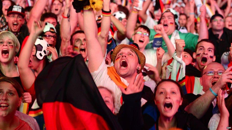 Germany fans cheer during a public viewing at the Brandenburg Gate in Berlin on July 8, 2014.