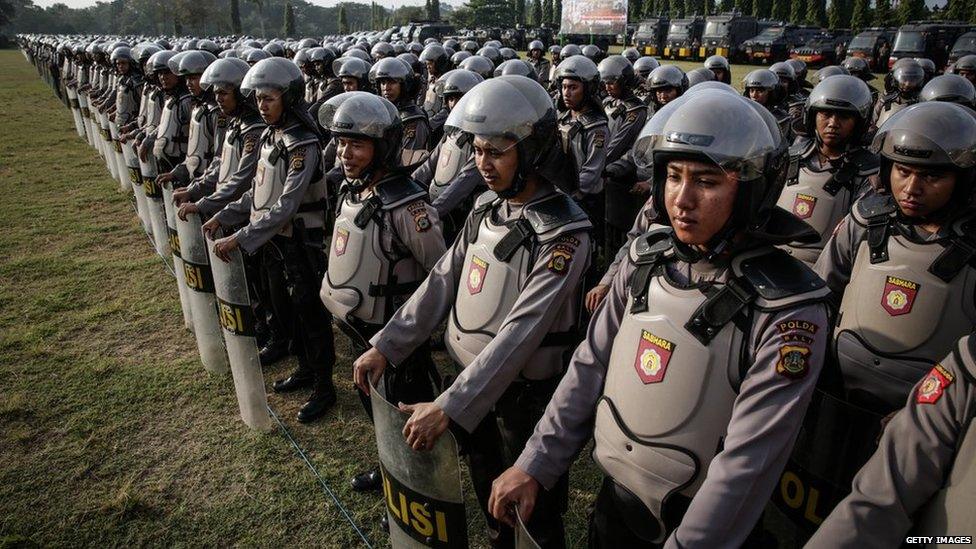 Indonesian police personnel line up during security preparations on 7 July, 2014 in Denpasar, Bali, Indonesia