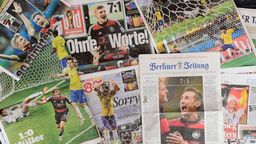 Front pages of German newspapers showing photos from the FIFA World Cup 2014 semi-final football match between Germany and Brazil on July 9, 2014 in Berlin.