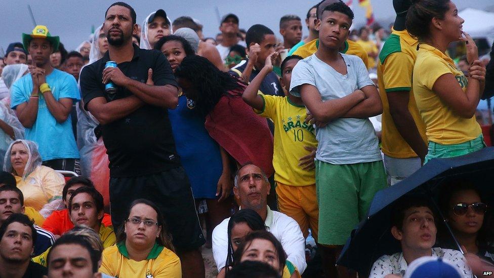 Brazil fans watch the first half on Copacabana Beach during the 2014 FIFA World Cup semi-final match between Brazil and Germany on 8 July 2014 in Rio de Janeiro, Brazil.