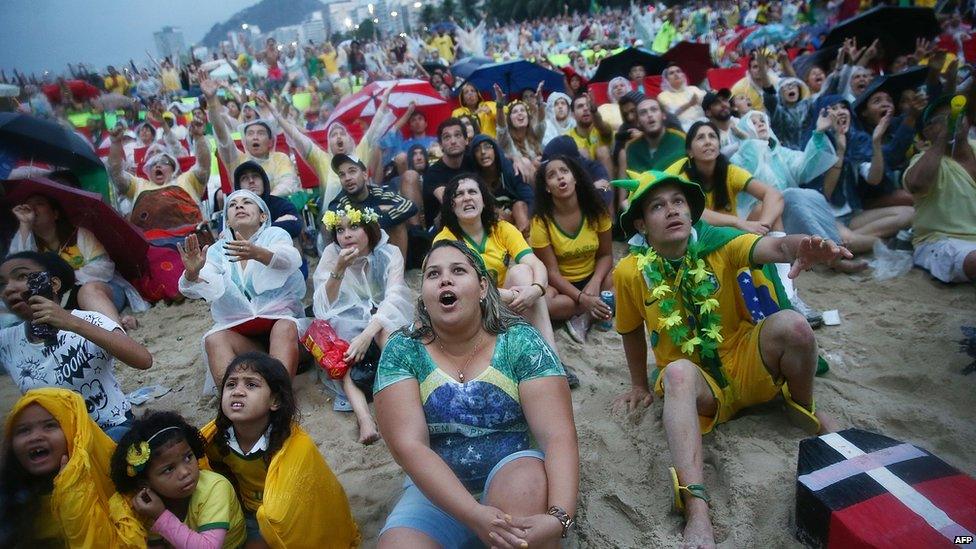 Brazil fans watch the first half on Copacabana Beach during the 2014 FIFA World Cup semi-final match between Brazil and Germany on 8 July 2014