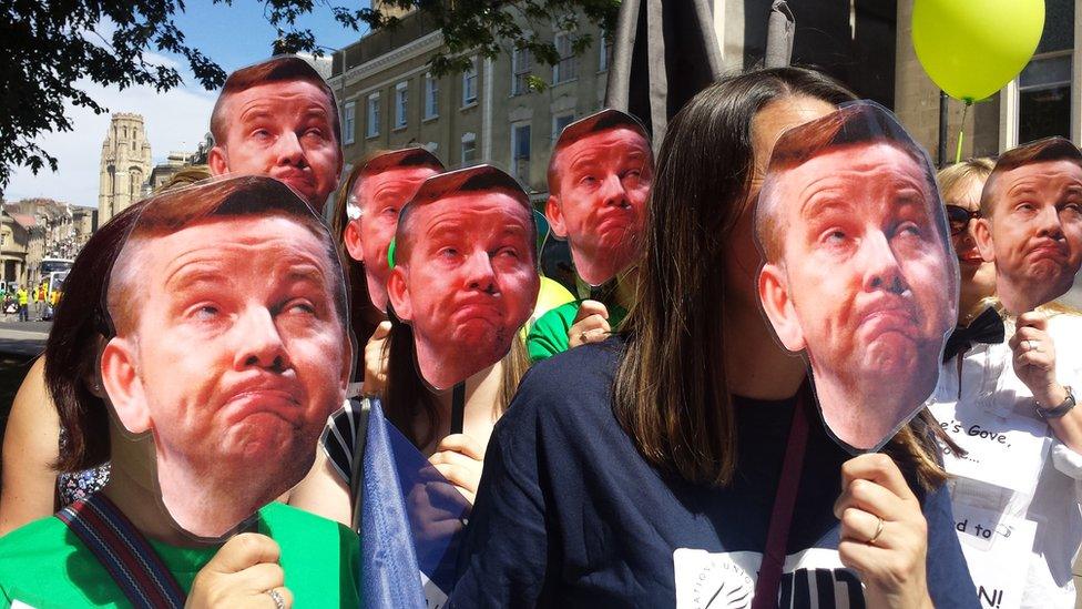 Public sector workers striking in Bristol with Michael Gove masks.