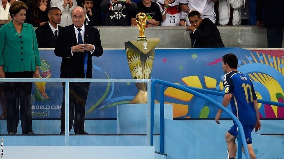 Argentina's Lionel Messi makes the walk up the stairs to receive his loser's medal