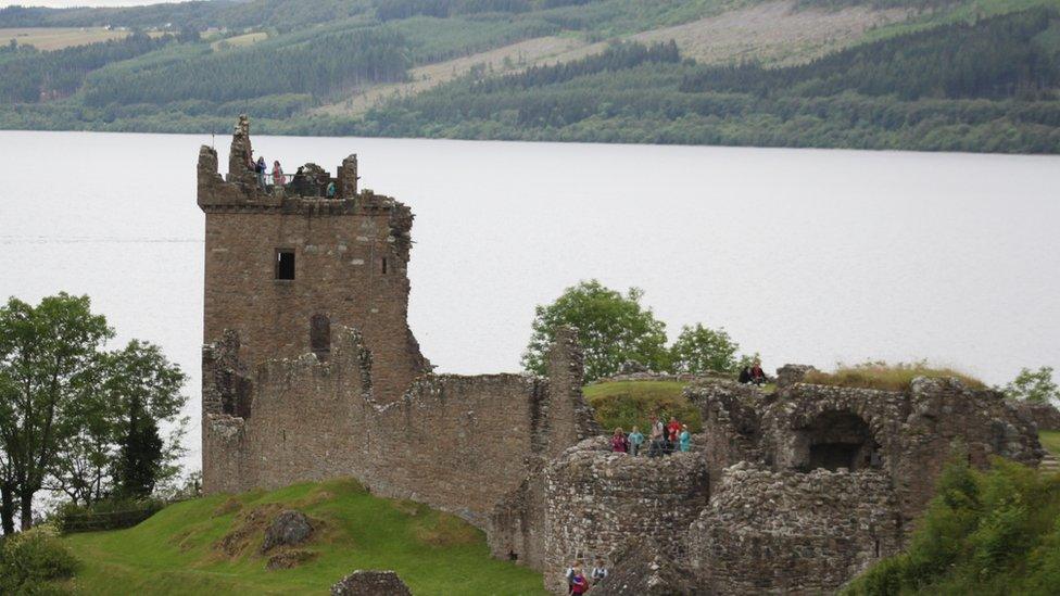 Ruined castle on shore of large body of water