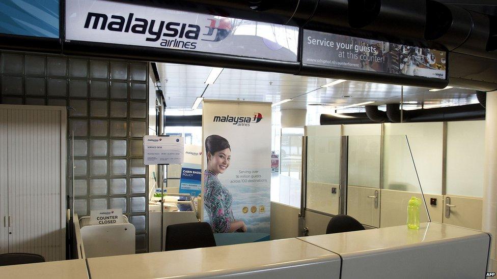 A closed Malaysia Airlines counter at the Schiphol airport near Amsterdam, 17 July 2014