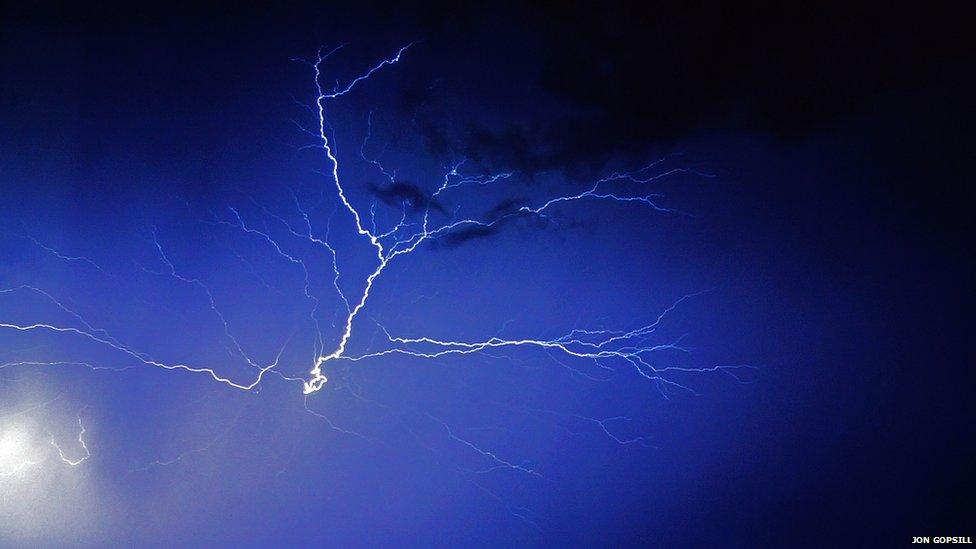 A fork of lightning in the sky at night