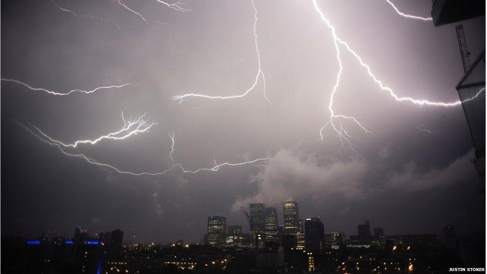 Lightning striking Canary Wharf at night