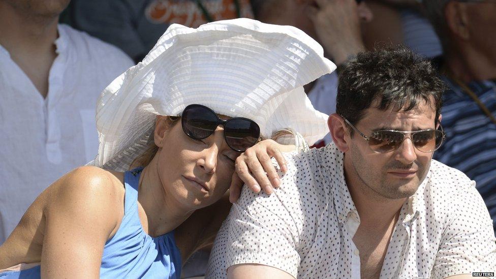 A woman sleeping in the sun at Lord's