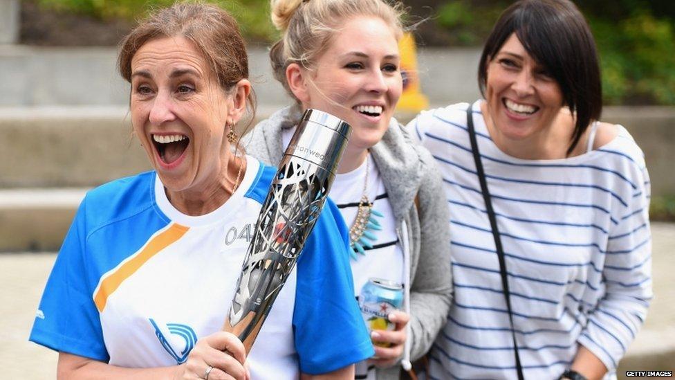 Broadcaster Kirsty Wark carries the Queens Baton Relay as it arrives in Glasgow