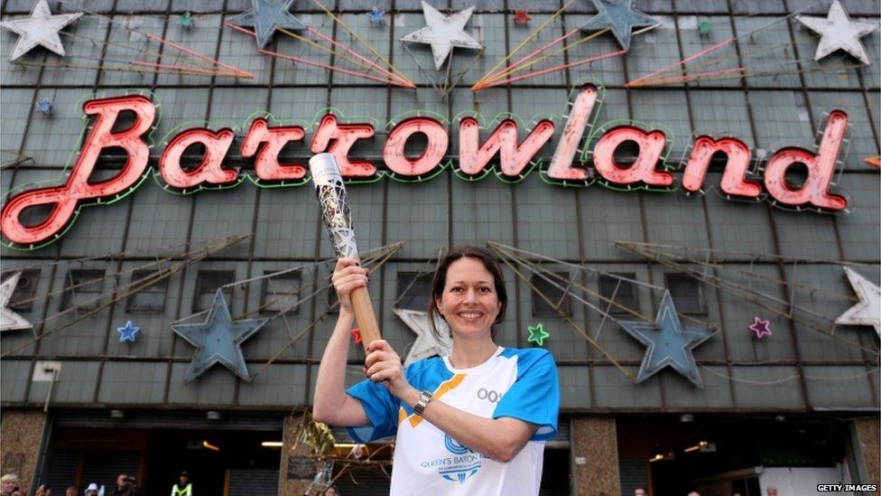 Batonbearer 005 Sarah McGibbon carries the Glasgow 2014 Queen"s Baton at the Barrowland