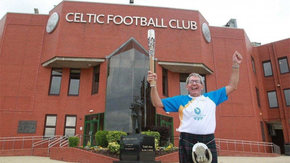 Batonbearer 062 John Zambonini carries the Glasgow 2014 Queen"s Baton at Celtic Park, home of Celtic Football Club