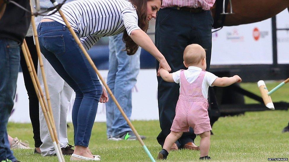 Prince George was photographed walking with the help of his mother