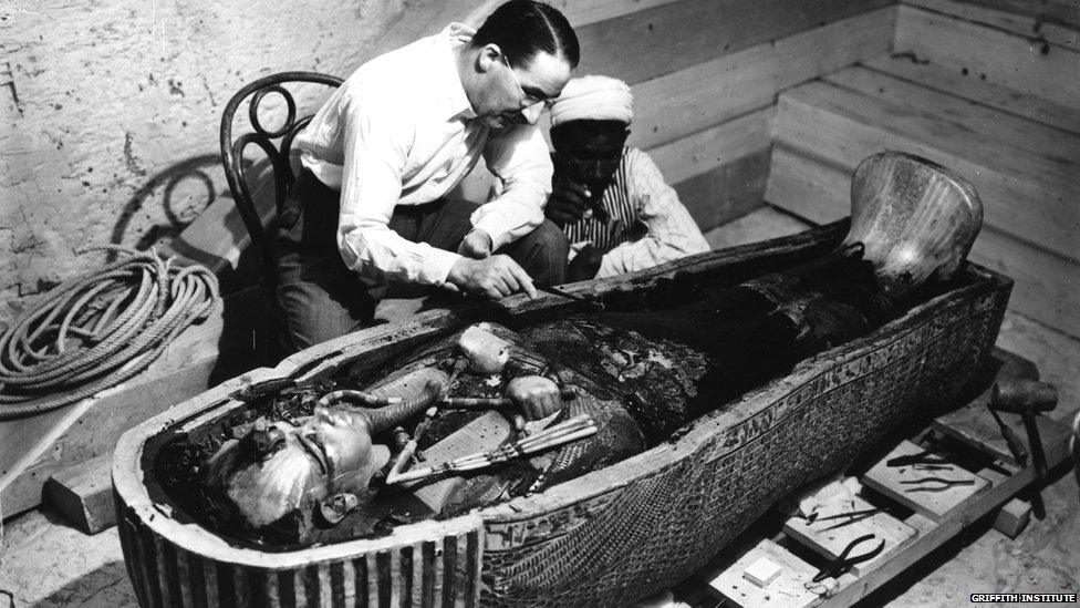 Howard Carter and an assistant inspect Tutankhamun's inner coffin. (Photo: Harry Burton. 1922)