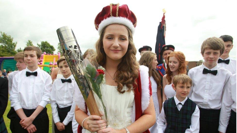 Jennifer Pryce, the Corsehill Queen at the Bonnet Guild Gala Day at Lainshaw Primary School, with the Glasgow 2014 Queen's Baton in Stewarton, East Ayrshire.