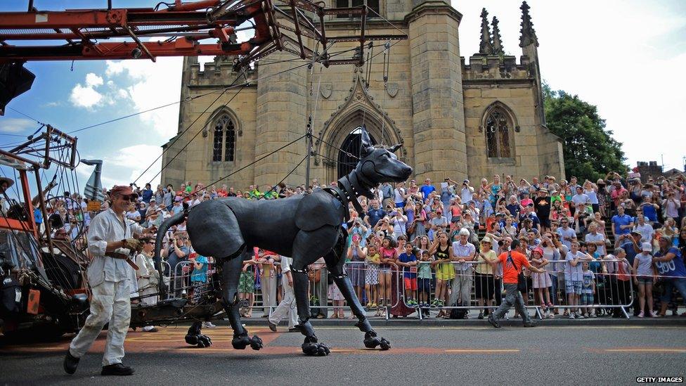 A puppet dog walking the streets of Liverpool.