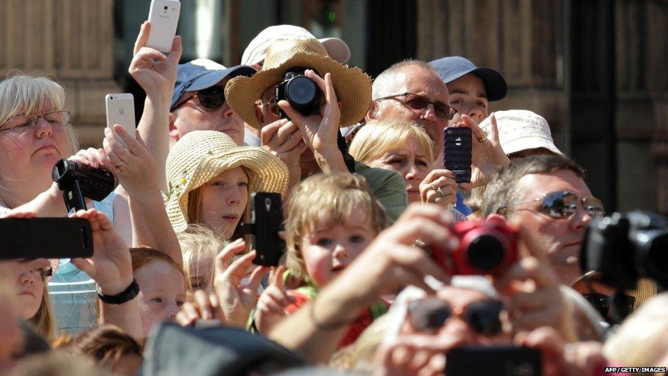 People photographing the Giants