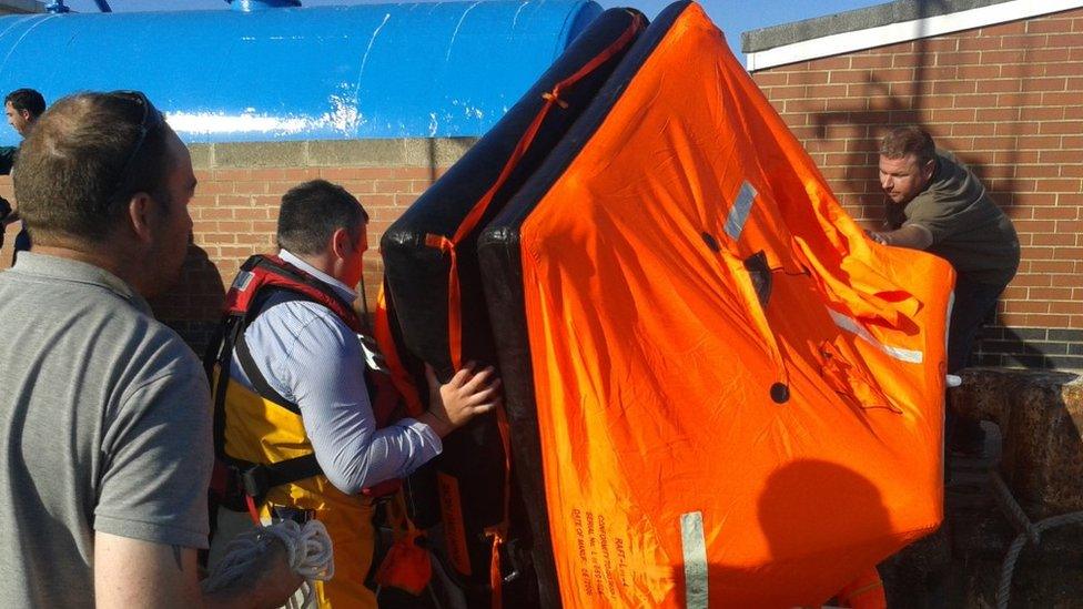 Life-raft being brought ashore at Hartlepool Fish Quay