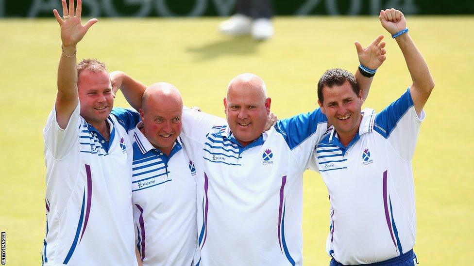 Scotland's fours celebrate their 16-8 win over England in the final. (Left to right) Paul Foster, David Peacock, Alex Marshall and Neil Speirs salute the crowd at Kelvingrove.